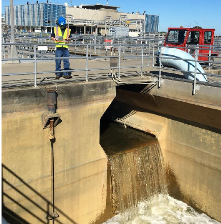 roject worker collecting water level readings during flow meter functional testing at the Secondary Battery B area.