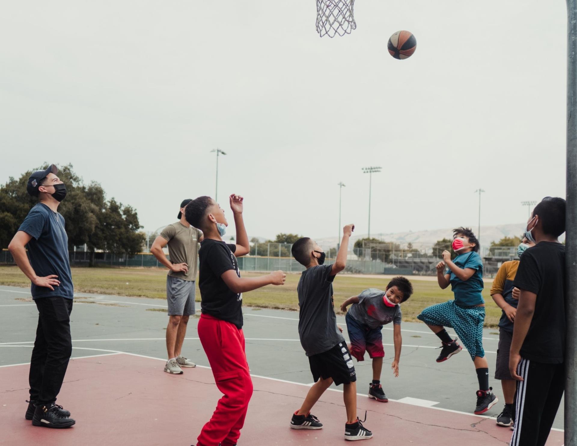 Camp San José participants playing basketball