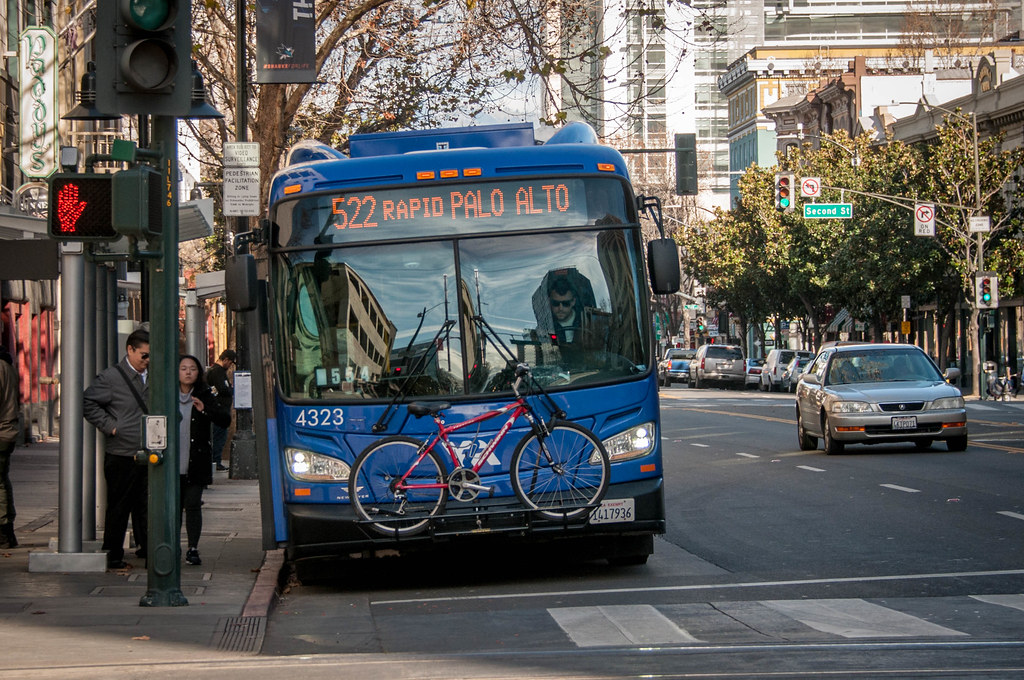 522 rapid bus at a stop on a busy street