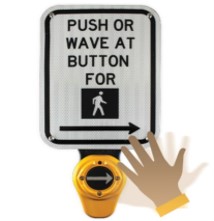 A figure of a hand waving over a touchless APS button