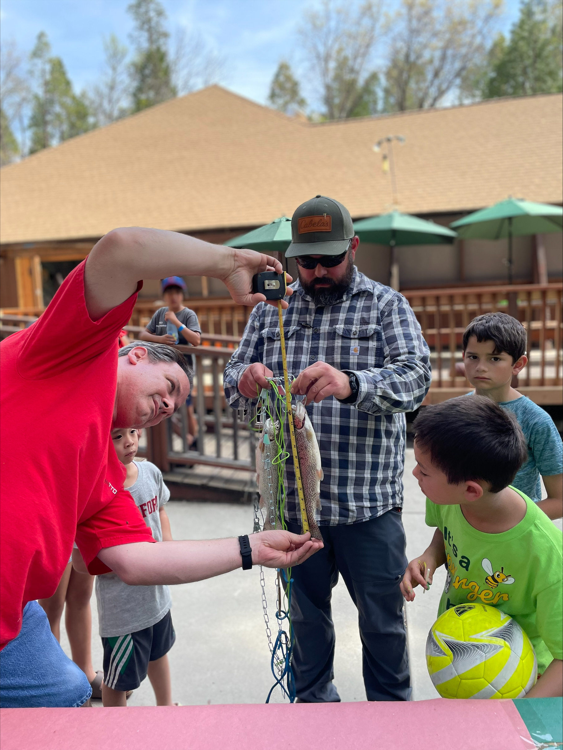 fish camp participants measuring caught fish