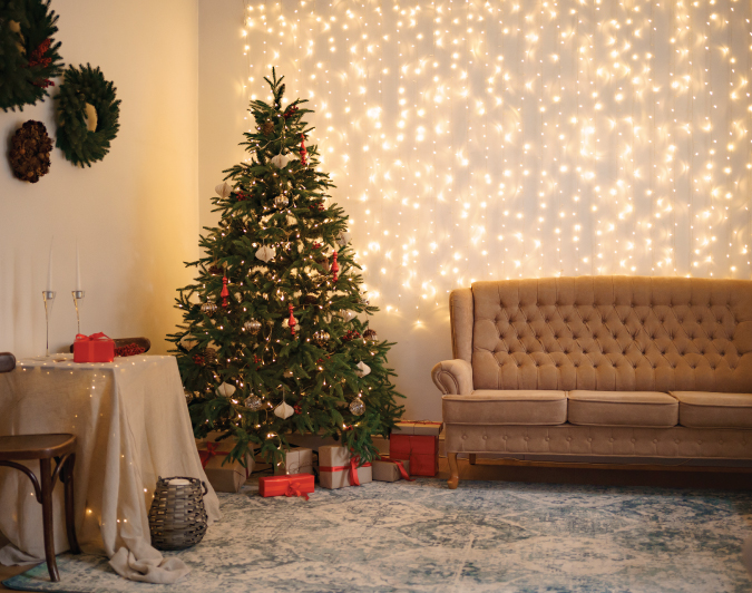 A Christmas tree in a living room.