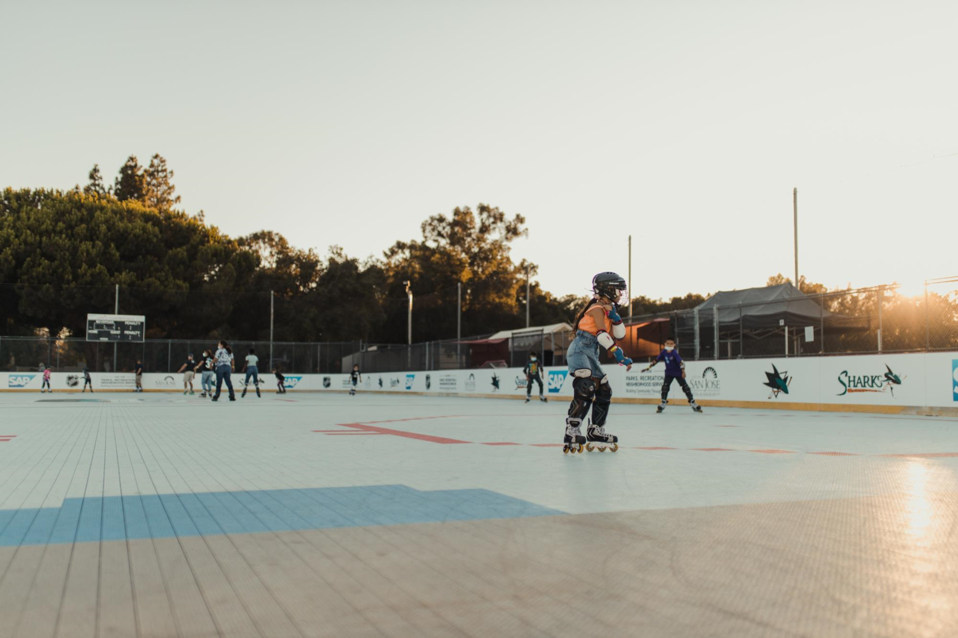 Kids at Roosevelt Community Center roller rink during an event