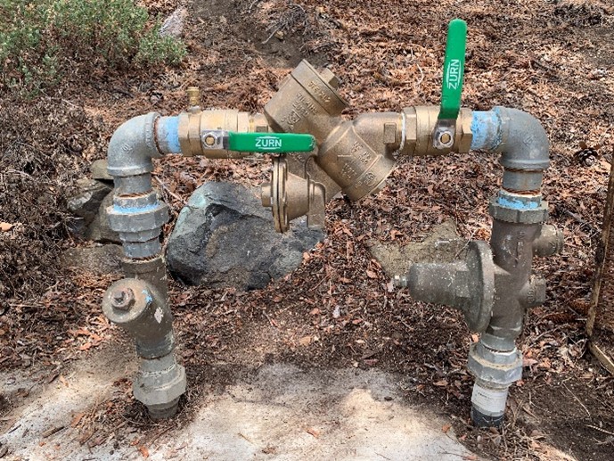 Brown and green reduced Pressure Principle Backflow Assembly