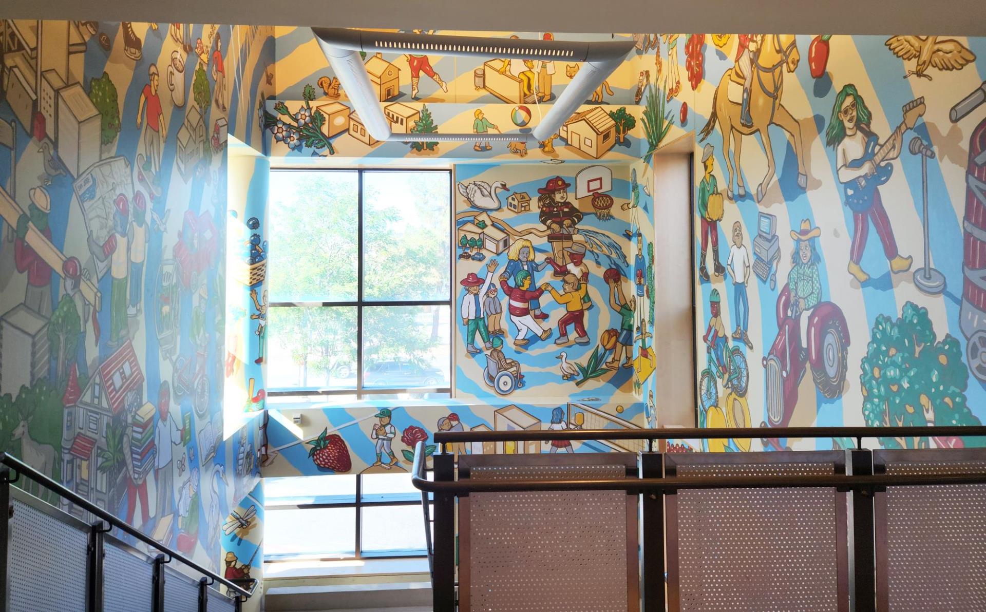 wide angle photo of interior multicolor public art mural