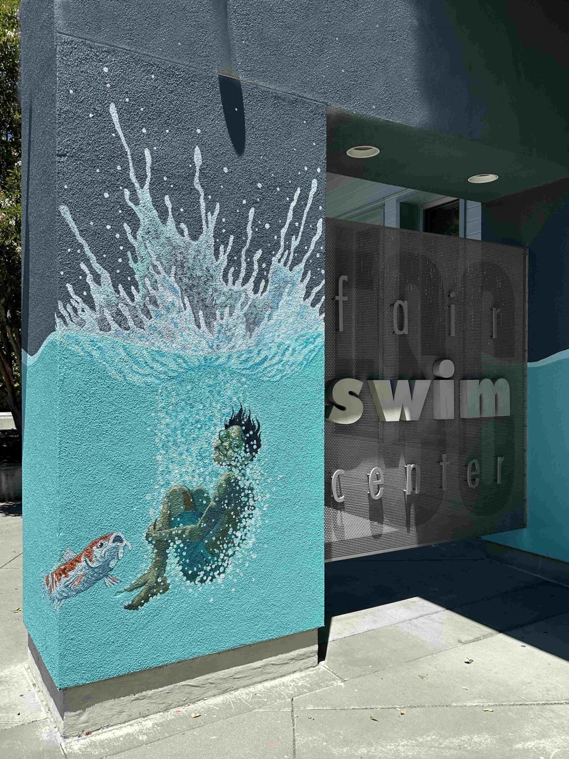 exterior public art mural at entrance of fair swim center