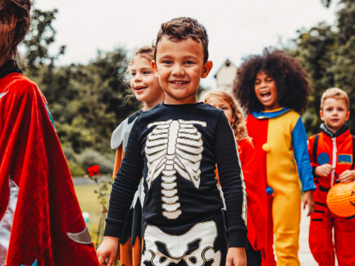 Several children trick-or-treating.