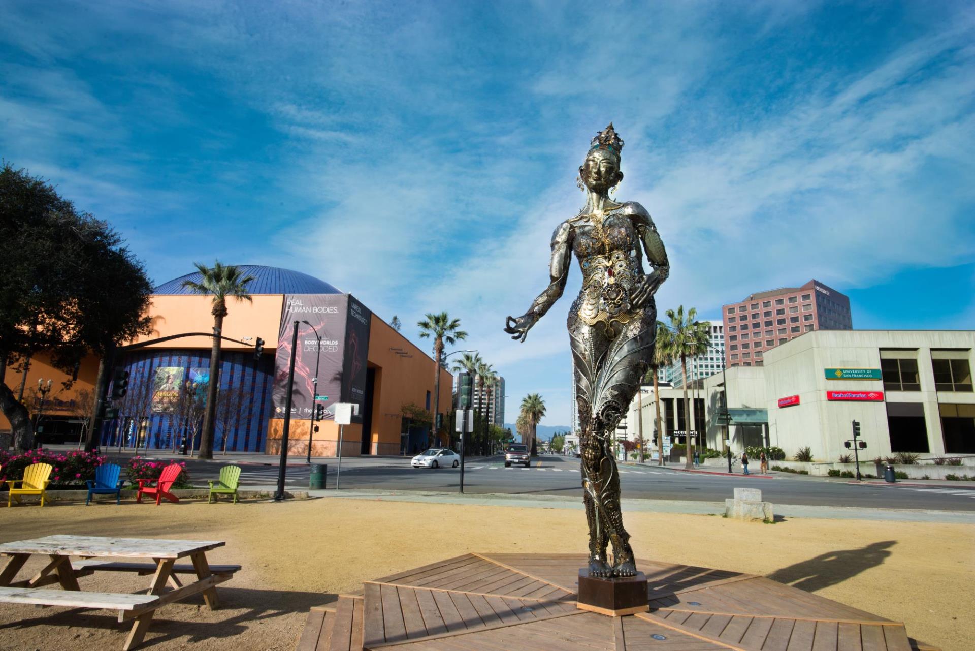 Sculpture of female figure made of machine parts installed at Plaza de Caesar Chavez 