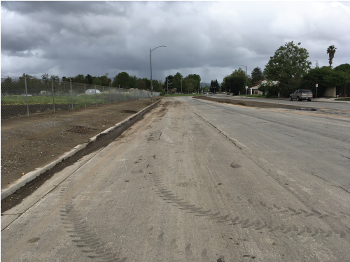 An image of Chynoweth Avenue, which looks very muddy.