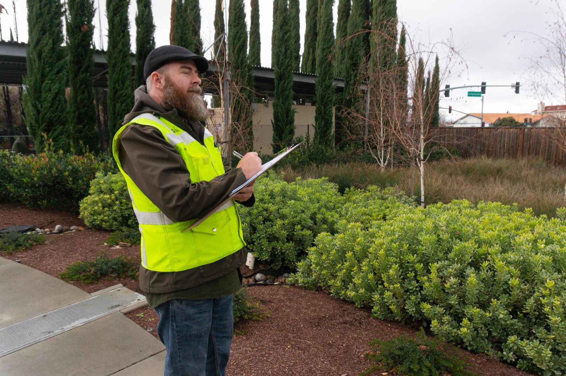 Completing inspection checklist at a bioretention basin